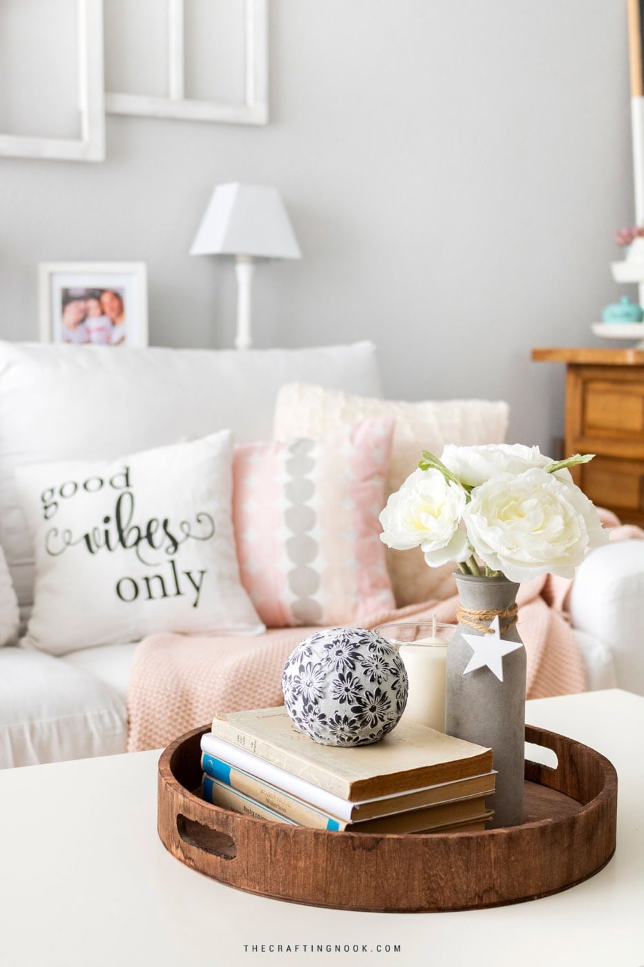 Beautiful living room with soft pastel accents and fresh flowers for seasonal decor.
