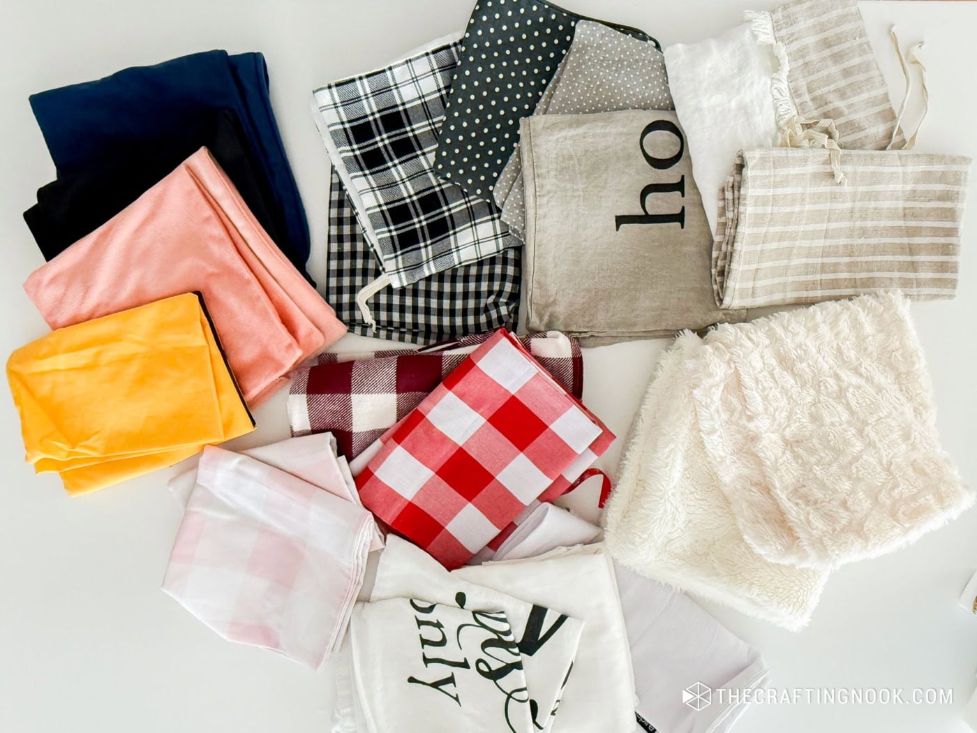 Vibrant fabric samples including plaid, polka dots, and solids for seasonal decorating ideas.