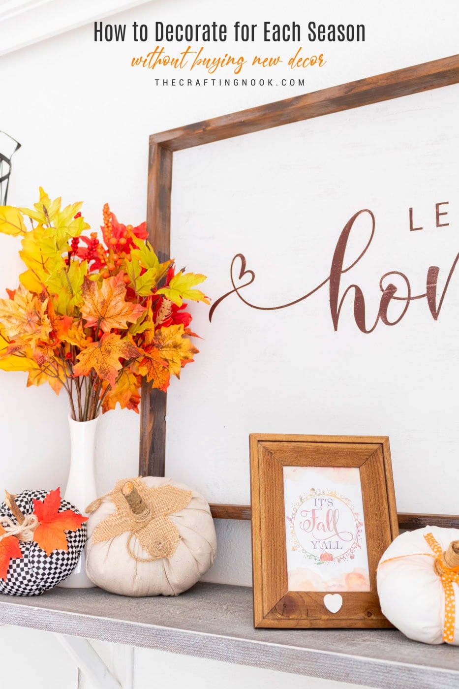 Autumn-themed home decor with pumpkins, leaves, and framed fall quote.