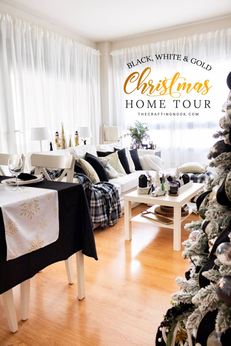 Elegant black, white, and gold Christmas home tour featuring a flocked Christmas tree, white sofa, plaid throws, and festive dining table.
