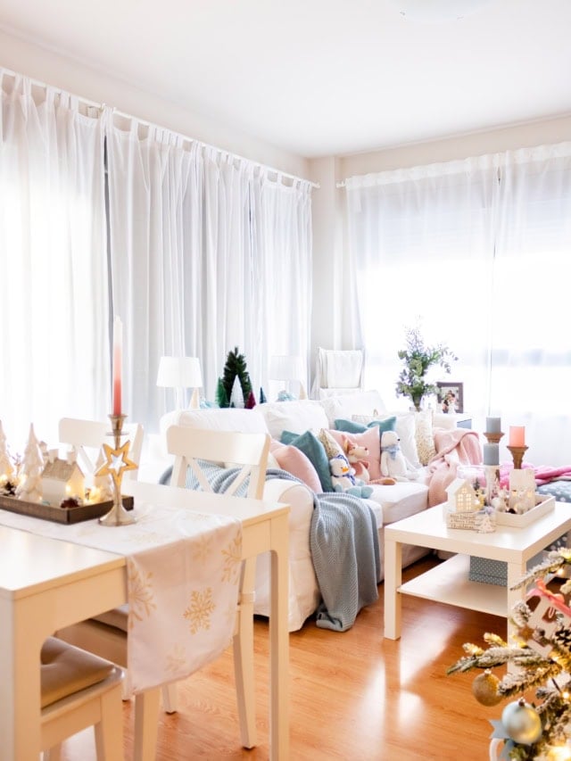 View from the dining table to the living room, with a pastel Christmas coffee table and sofa
