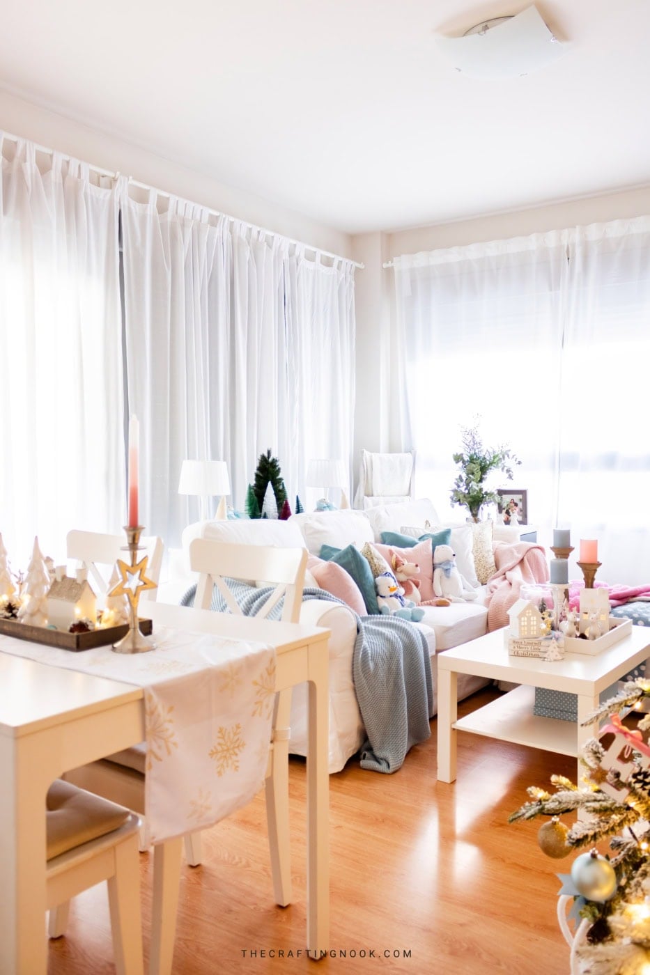 View from the dining table to the living room, with a pastel Christmas coffee table and sofa